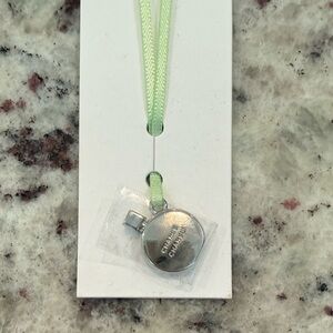 CHANEL Limited Edition 2024 Silver Pendant with Green Ribbon
